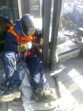 Welding a Frame in City Building